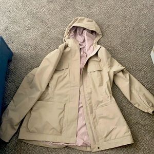a beige north face jacket